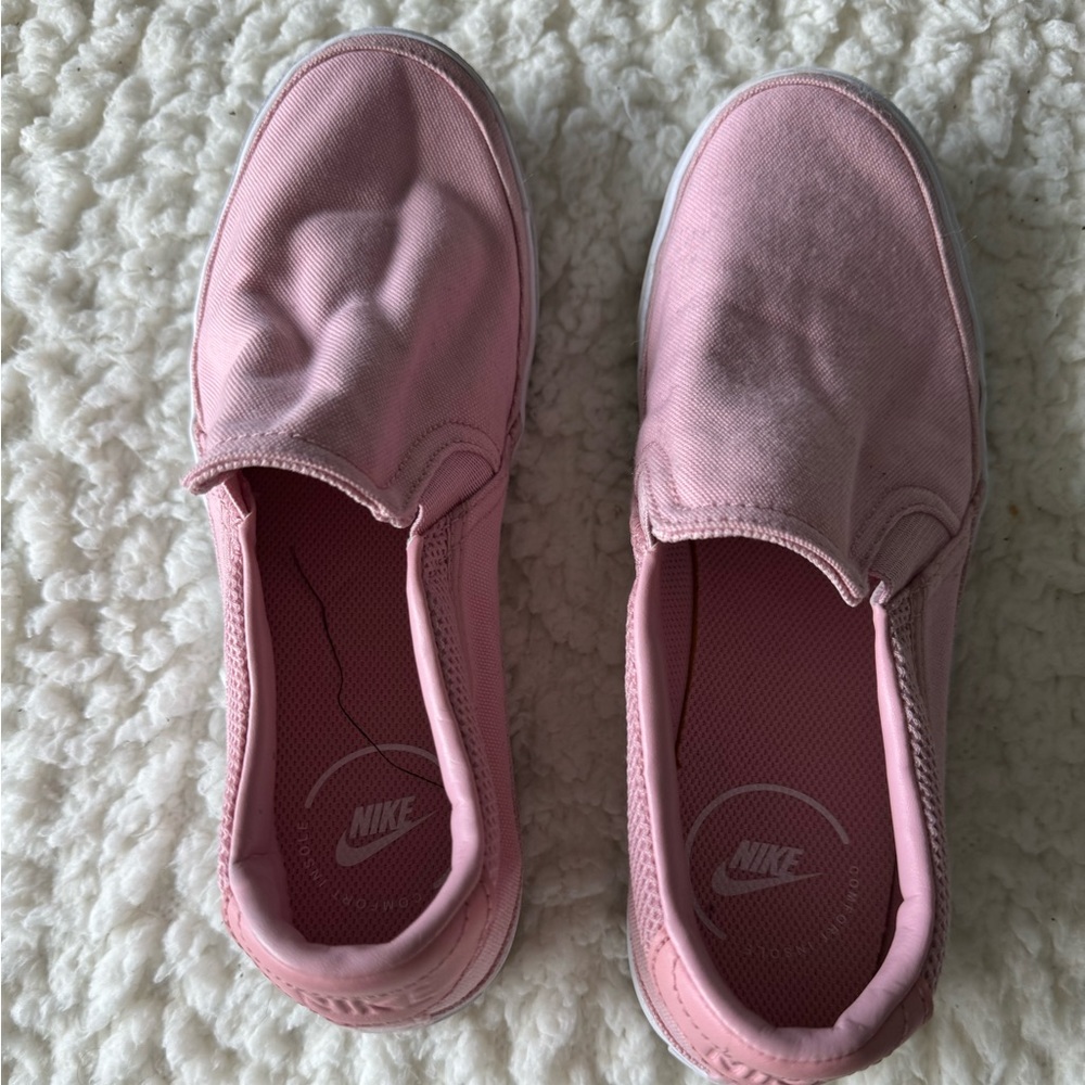 Pink Nike slip on canvas sneakers